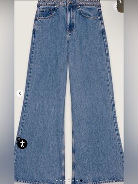 Flared jeans with studded waistband